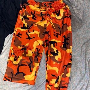 Orange Camo silky pants with cuffed bottoms and string around waist